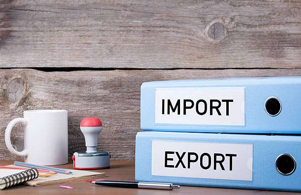 import and export. two binders on desk in the office. business background