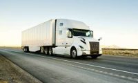 large semi truck hauling freight on the open highway in the western usa.